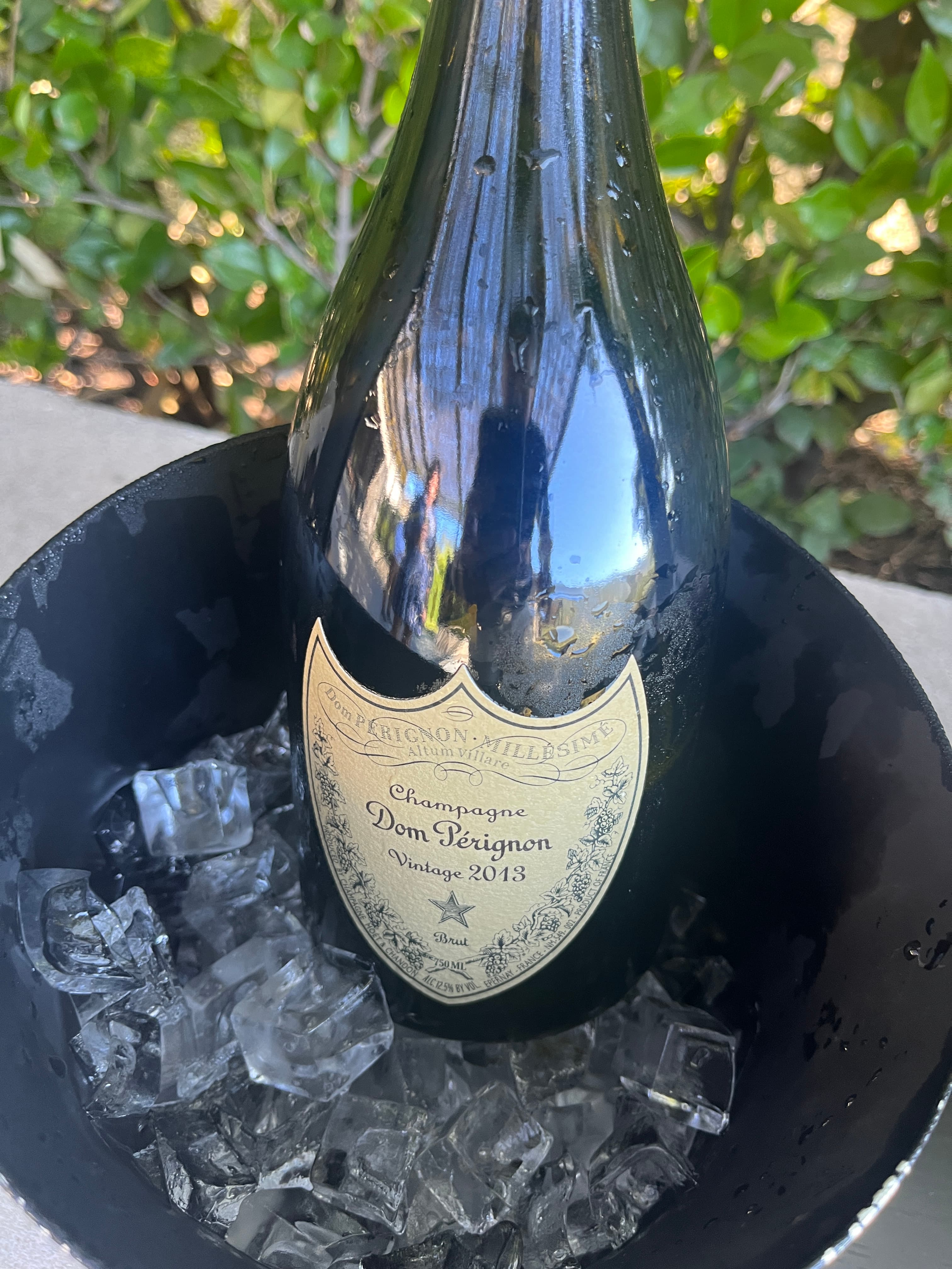 A bottle of Champagne chilling in an ice bucket